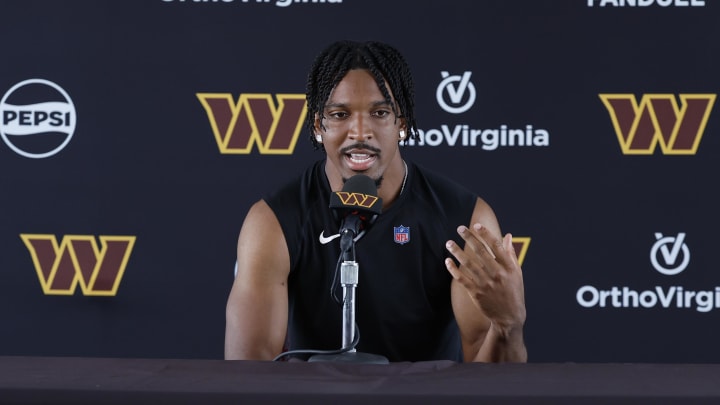 Jul 26, 2024; Ashburn, VA, USA; Washington Commanders quarterback Jayden Daniels speaks with the media after morning practice on day three of training camp at Commanders Park. Mandatory Credit: Geoff Burke-USA TODAY Sports