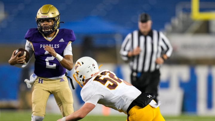 Cooper Jaguars linebacker Lucas Hughes attempts to put a stop to Bowling Green Purples quarterback Deuce Bailey (2) during the KHSAA Class 5A 2023 UK HealthCare Sports Medicine state finals football game between Cooper Jaguars and Bowling Green Purples on Saturday, Dec. 2, 2023, at Kroger Field in Lexington, Ky.