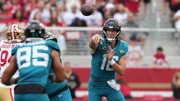 Sep 28, 2025; Santa Clara, California, USA; Jacksonville Jaguars quarterback Trevor Lawrence (center) passes to tight end Brenton Strange (85) during the second quarter against the San Francisco 49ers at Levi's Stadium. 