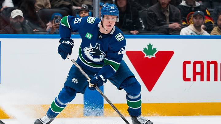 Mar 24, 2026; Vancouver, British Columbia, CAN; Vancouver Canucks defenseman Elias Pettersson (25) handles the puck against the Anaheim Ducks in the second period at Rogers Arena. Mandatory Credit: Bob Frid-Imagn Images
