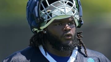 Jul 29, 2023; Oxnard, CA, USA; Dallas Cowboys defensive tackle Mazi Smith (58) wears a Guardian helmet cap during training camp at the River Ridge Fields.