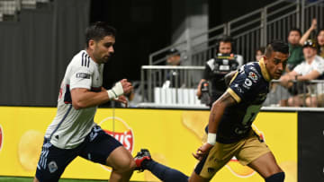 Aug 7, 2024; Vancouver, British Columbia, CAN;  Pumas UNAM defender Robert Ergas (22) controls the ball against Vancouver Whitecaps FC forward Brian White (24) during the second half at BC Place. Mandatory Credit: Simon Fearn-USA TODAY Sports