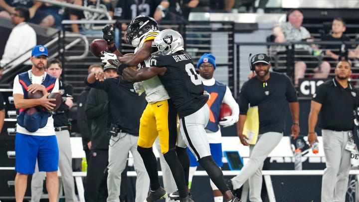 Sep 24, 2023; Paradise, Nevada, USA; Las Vegas Raiders cornerback Jakorian Bennett (0) breaks up a pass attempt to Pittsburgh Steelers guard Spencer Anderson (74) during the second quarter at Allegiant Stadium. Mandatory Credit: Stephen R. Sylvanie-USA TODAY Sports