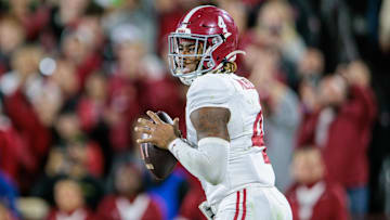Nov 23, 2024; Norman, Oklahoma, USA; Alabama Crimson Tide quarterback Jalen Milroe (4) passes the ball during the fourth quarter against the Oklahoma Sooners at Gaylord Family-Oklahoma Memorial Stadium. Mandatory Credit: William Purnell-Imagn Images