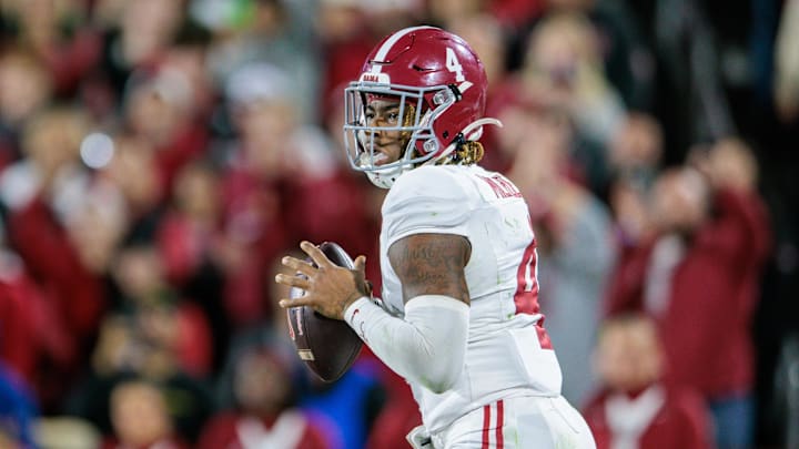 Nov 23, 2024; Norman, Oklahoma, USA; Alabama Crimson Tide quarterback Jalen Milroe (4) passes the ball during the fourth quarter against the Oklahoma Sooners at Gaylord Family-Oklahoma Memorial Stadium. Mandatory Credit: William Purnell-Imagn Images