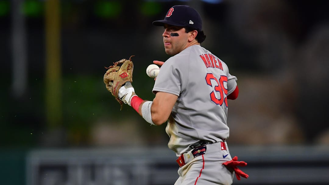 Jun 24, 2025; Anaheim, California, USA; Boston Red Sox second baseman Marcelo Mayer (39) loses control of the ball for the throw to first against Los Angeles Angels center fielder Jo Adell (7). during the seventh inning at Angel Stadium. Mandatory Credit: Gary A. Vasquez-Imagn Images