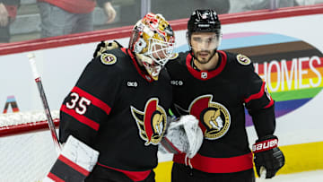 Apr 3, 2025; Ottawa, Ontario, CAN; Ottawa Senators goalie Linus Ullmark (35) and defenseman Artem Zub (2) celebrate their win against the Tampa Bay Lightning at the Canadian Tire Centre. Mandatory Credit: Marc DesRosiers-Imagn Images