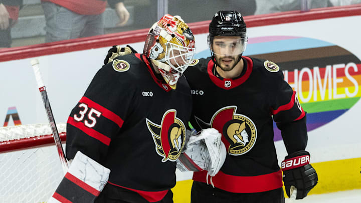 Apr 3, 2025; Ottawa, Ontario, CAN; Ottawa Senators goalie Linus Ullmark (35) and defenseman Artem Zub (2) celebrate their win against the Tampa Bay Lightning at the Canadian Tire Centre. Mandatory Credit: Marc DesRosiers-Imagn Images