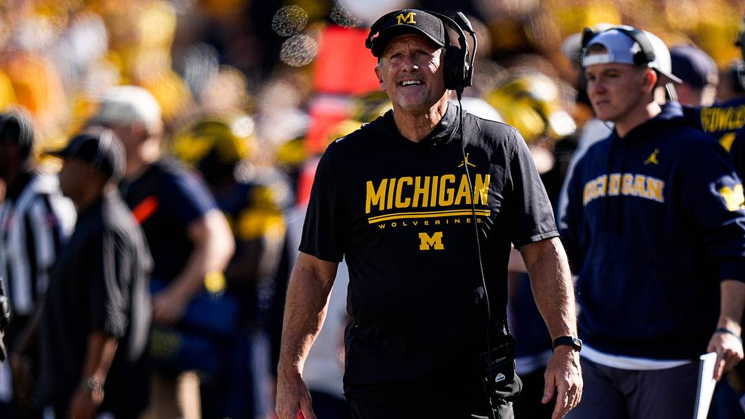 Michigan head coach Kyle Whittingham watches a play against Iowa