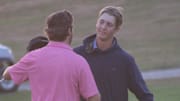 Ferris State University teammates Caleb Bond (right) and Shayne Beaufait embrace following the second playoff hole in the Northern Michigan Open on Sunday night.