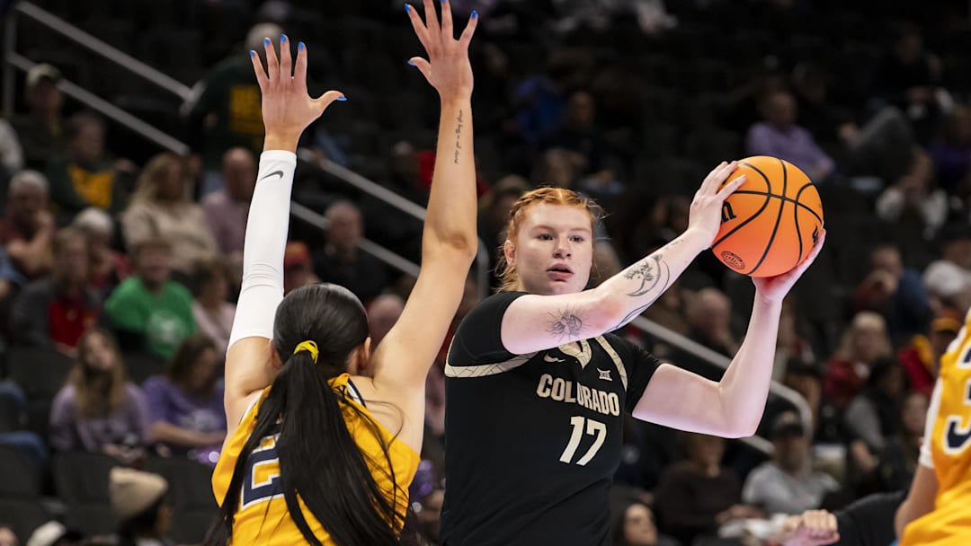 Mar 7, 2026; Kansas City, MO, USA;  Colorado Buffaloes forward Tabitha Betson (17) looks for an open teammate against the West Virginia Mountaineers during the first half at T-Mobile Center. Mandatory Credit: Nick Tre. Smith-Imagn Images