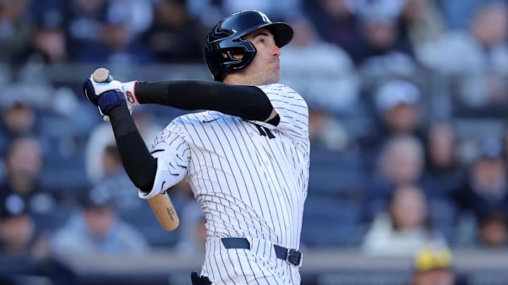Mar 27, 2025; Bronx, New York, USA; New York Yankees center fielder Cody Bellinger (35) follows through on an RBI sacrifice fly during the seventh inning against the Milwaukee Brewers at Yankee Stadium. / Brad Penner-Imagn Images