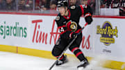 Dec 5, 2024; Ottawa, Ontario, CAN; Ottawa Senators defenseman Jacob Bernard-Docker (24) controls the puck in the second period against the Detroit Red Wings at the Canadian Tire Centre. Mandatory Credit: Marc DesRosiers-Imagn Images