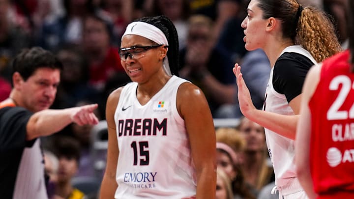 An official points at Atlanta Dream guard Allisha Gray.