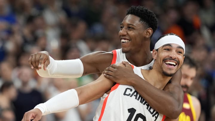 Aug 2, 2024; Villeneuve-d'Ascq, France; Canada small forward RJ Barrett (9) and point guard Andrew Nembhard (19) celebrate after defeating Spain in a men’s group A basketball game during the Paris 2024 Olympic Summer Games at Stade Pierre-Mauroy. Mandatory Credit: John David Mercer-USA TODAY Sports