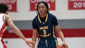 Wayne Memorial's Carlos Medlock sets up the offense during a Division 1 boys basketball district championship on Friday, March 1, 2024.