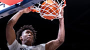 Xavier Musketeers guard-forward Dailyn Swain (3) dunks in the first half of the NCAA basketball game between Xavier Musketeers and Villanova Wildcats at the Cintas Center in Cincinnati on Wednesday, Feb. 7, 2024.