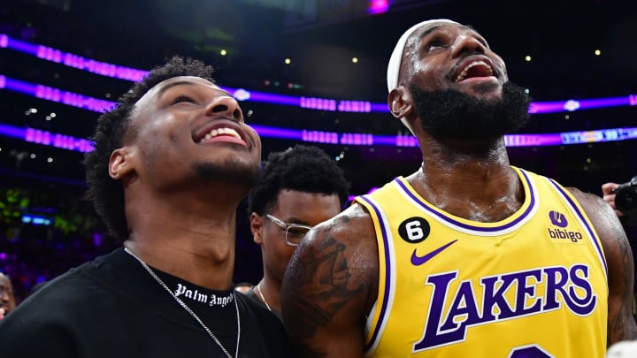 Feb 7, 2023; Los Angeles, California, USA; Los Angeles Lakers forward LeBron James (6) celebrates with his son Bronny James after breaking the all-time scoring record in the third quarter against the Oklahoma City Thunder at Crypto.com Arena. 