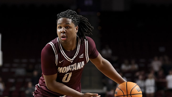Nov 18, 2025; College Station, Texas, USA; Montana Grizzlies guard Money Williams (0) looks to pass the ball during the second half against the Texas A&M Aggies at Reed Arena. Mandatory Credit: Maria Lysaker-Imagn Images 