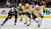 Dec 14, 2024; Denver, Colorado, USA; Nashville Predators center Jonathan Marchessault (81) controls the puck ahead of center Steven Stamkos (91) and Colorado Avalanche right wing Valeri Nichushkin (13) in the first period at Ball Arena. Mandatory Credit: Isaiah J. Downing-Imagn Images