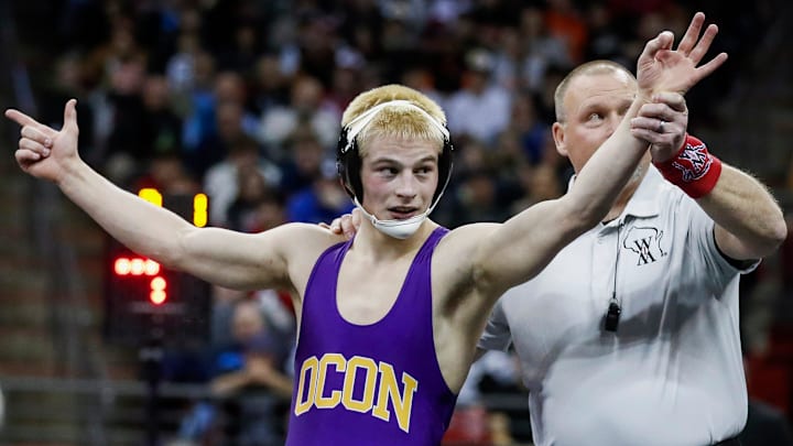 Oconomowoc High School's Kellen Wolbert holds up three fingers after winning his third state title in the Division 1, 144-pound championship match at the WIAA state individual wrestling tournament on Saturday, March 1, 2025. Tork Mason/USA TODAY NETWORK-Wisconsin