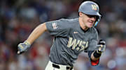 Aug 30, 2024; Washington, District of Columbia, USA; Washington Nationals outfielder Jacob Young (30) singles during the ninth inning against the Chicago Cubs at Nationals Park.