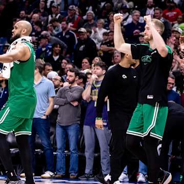 Jan 31, 2025; New Orleans, Louisiana, USA;  Boston Celtics guard Derrick White (9) and forward Sam Hauser (30) cheer as they defeat the New Orleans Pelicans  at Smoothie King Center. Mandatory Credit: Stephen Lew-Imagn Images