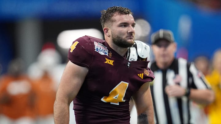 Jan 1, 2025; Atlanta, GA, USA; Arizona State Sun Devils running back Cam Skattebo (4) reacts after losing his helmet while being tackled by Texas Longhorns defensive back Michael Taaffe (16) during the second half of the Peach Bowl at Mercedes-Benz Stadium. Jan 1, 2025; Atlanta, GA, USA; Arizona State Sun Devils running back Cam Skattebo (4) reacts after losing his helmet while being tackled by Texas Longhorns defensive back Michael Taaffe (16) during the second half of the Peach Bowl at Mercedes-Benz Stadium.
