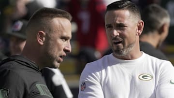 Green Bay Packers defensive coordinator Jeff Hafley, left, talks with head coach Matt LaFleur before their game against the Houston Texans at Lambeau Field.