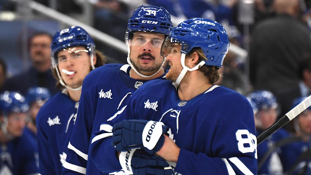 Dec 4, 2024; Toronto, Ontario, CAN;  Toronto Maple Leafs forward Auston Matthews (34) speaks with forward William Nylander (88) as forward Matthew Knies (23) looks on in the first period against the Nashville Predators at Scotiabank Arena. Mandatory Credit: Dan Hamilton-Imagn Images