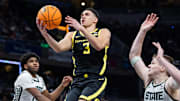 Mar 14, 2025; Indianapolis, IN, USA; Oregon Ducks guard Jackson Shelstad (3)  shoots the ball while Michigan State Spartans guard Jase Richardson (11) defends in the second half  at Gainbridge Fieldhouse. Mandatory Credit: Trevor Ruszkowski-Imagn Images