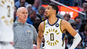 Mar 9, 2023; Indianapolis, Indiana, USA;  Indiana Pacers head coach Rick Carlisle and guard Tyrese Haliburton (0) in the second half against the Houston Rockets at Gainbridge Fieldhouse. Mandatory Credit: Trevor Ruszkowski-Imagn Images