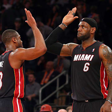 Feb 1, 2014; New York, NY, USA; Miami Heat small forward LeBron James (6) high fives Heat shooting guard Dwyane Wade (3) during the fourth quarter of a game against the New York Knicks at Madison Square Garden. The Heat defeated the Knicks 106-91. Mandatory Credit: Brad Penner-Imagn Images