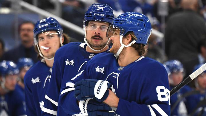 Dec 4, 2024; Toronto, Ontario, CAN;  Toronto Maple Leafs forward Auston Matthews (34) speaks with forward William Nylander (88) as forward Matthew Knies (23) looks on in the first period against the Nashville Predators at Scotiabank Arena. Mandatory Credit: Dan Hamilton-Imagn Images