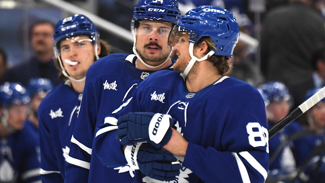 Dec 4, 2024; Toronto, Ontario, CAN;  Toronto Maple Leafs forward Auston Matthews (34) speaks with forward William Nylander (88) as forward Matthew Knies (23) looks on in the first period against the Nashville Predators at Scotiabank Arena. Mandatory Credit: Dan Hamilton-Imagn Images
