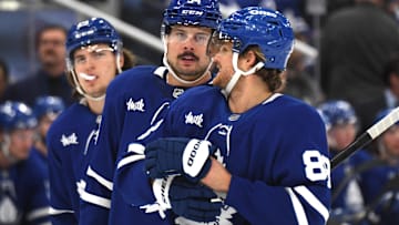 Dec 4, 2024; Toronto, Ontario, CAN;  Toronto Maple Leafs forward Auston Matthews (34) speaks with forward William Nylander (88) as forward Matthew Knies (23) looks on in the first period against the Nashville Predators at Scotiabank Arena. Mandatory Credit: Dan Hamilton-Imagn Images