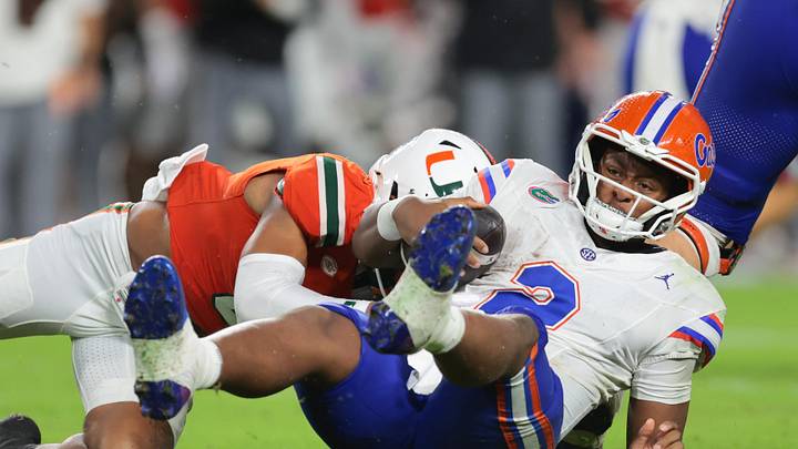 Sep 20, 2025; Miami Gardens, Florida, USA; Florida Gators quarterback DJ Lagway (2) is sacked by Florida Gators linebacker Aaron Chiles (8) during the second quarter at Hard Rock Stadium. Mandatory Credit: Sam Navarro-Imagn Images