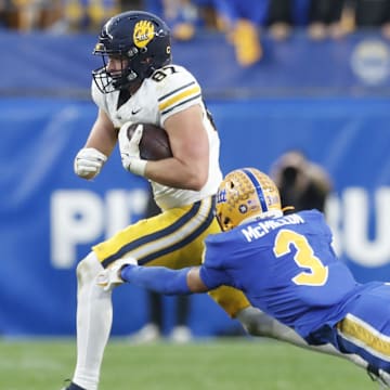Oct 12, 2024; Pittsburgh, Pennsylvania, USA;  California Golden Bears tight end Jack Endries (87) runs after  catch against Pittsburgh Panthers defensive back Donovan McMillon (3) during the fourth quarter at Acrisure Stadium. Pittsburgh won 17-15. Mandatory Credit: Charles LeClaire-Imagn Images
