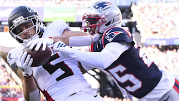 Nov 2, 2025; Foxborough, Massachusetts, USA; Atlanta Falcons wide receiver Drake London (5) makes a catch for a touchdown against New England Patriots cornerback Marcus Jones (25) during the second quarter at Gillette Stadium.
