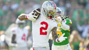 Ohio State Buckeyes wide receiver Emeka Egbuka (2) catches a touchdown in front of Oregon Ducks defensive back Brandon Johnson (3) during the first half of the College Football Playoff quarterfinal at the Rose Bowl in Pasadena, Calif. on Jan. 1, 2025.