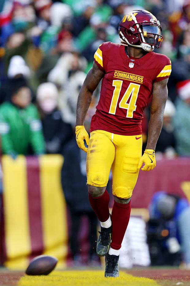 Washington Commanders wide receiver Olamide Zaccheaus celebrates after scoring a touchdown Washington Commanders wide receiver Olamide Zaccheaus celebrates after scoring a touchdown