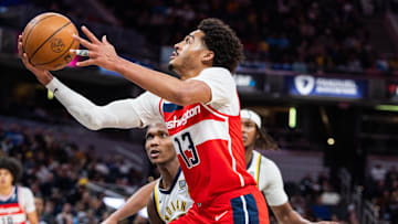 Apr 8, 2025; Indianapolis, Indiana, USA; Washington Wizards guard Jordan Poole (13) shoots the ball while Indiana Pacers guard Bennedict Mathurin (00)  defends in the second half at Gainbridge Fieldhouse. Mandatory Credit: Trevor Ruszkowski-Imagn Images
