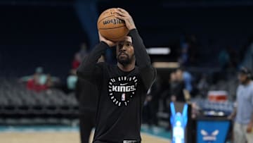 Apr 4, 2025; Charlotte, North Carolina, USA; Sacramento Kings guard Malik Monk (0) shoots during pregame warm ups against the Charlotte Hornets at Spectrum Center. Mandatory Credit: Jim Dedmon-Imagn Images