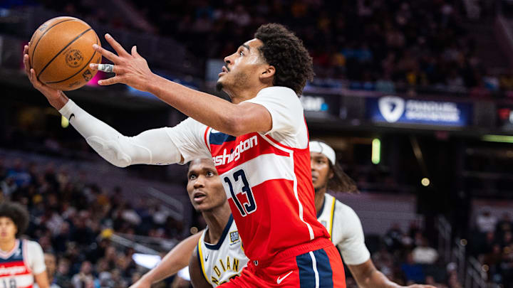 Apr 8, 2025; Indianapolis, Indiana, USA; Washington Wizards guard Jordan Poole (13) shoots the ball while Indiana Pacers guard Bennedict Mathurin (00)  defends in the second half at Gainbridge Fieldhouse. Mandatory Credit: Trevor Ruszkowski-Imagn Images