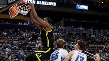 Mar 23, 2024; Pittsburgh, PA, USA; Oregon Ducks center N'Faly Dante (1) dunks the ball against Creighton Bluejays guard Baylor Scheierman (55) during the second half in the second round of the 2024 NCAA Tournament at PPG Paints Arena. Mandatory Credit: Charles LeClaire-Imagn Images