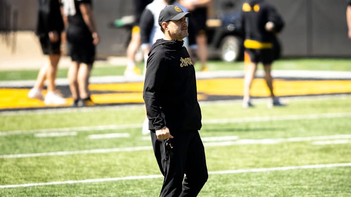 Apr 26, 2025; Iowa City, IA, USA; Iowa offensive coordinator and quarterbacks coach Tim Lester watches during a spring NCAA football open practice at Kinnick Stadium. Mandatory Credit: Joseph Cress/For the Register