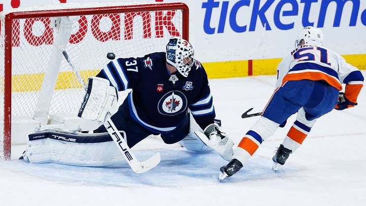 Jan 13, 2026; Winnipeg, Manitoba, CAN; New York Islanders forward Emil Heineman (51) scores on a penalty shot against Winnipeg Jets goalie Connor Hellebuyck (37) during the second period at Canada Life Centre. Mandatory Credit: Terrence Lee-Imagn Images Jan 13, 2026; Winnipeg, Manitoba, CAN; New York Islanders forward Emil Heineman (51) scores on a penalty shot against Winnipeg Jets goalie Connor Hellebuyck (37) during the second period at Canada Life Centre. Mandatory Credit: Terrence Lee-Imagn Images