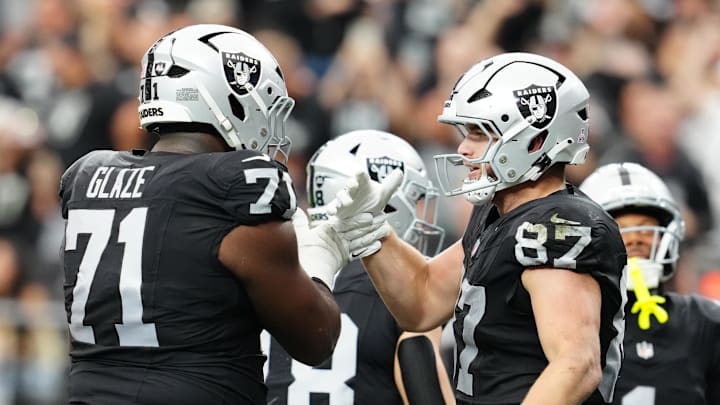 Oct 12, 2025; Paradise, Nevada, USA; Las Vegas Raiders tight end Michael Mayer (87) celebrates with Las Vegas Raiders offensive tackle DJ Glaze (71) after scoring a touch down during the second half against the Tennessee Titans at Allegiant Stadium. Mandatory Credit: Stephen R. Sylvanie-Imagn Images