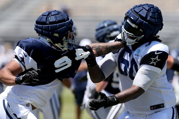  Cowboys defensive end Marshawn Kneeland and offensive tackle Tyler Guyton battle during training camp 
