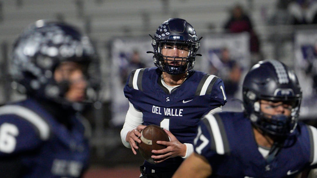 Del Valle High School's Jake Fette looks to make a throw during play against Cooper High School at Del Valle High School on Nov. 14, 2024. Del Valle won their opening playoff game.